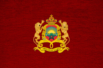 Flag and coat of arms of Kingdom of Morocco on a textured background. Concept collage.