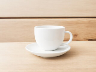 White cup of coffee on wooden table. Mockup