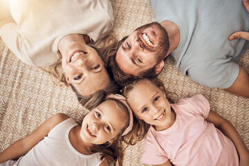 Love, portrait and top view of happy family on a floor bonding, relax and having fun at home...