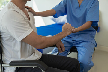 A doctor or physical therapist works to determine arm treatment, muscle stretching and exercises,...