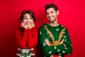 Photo of tricky cunning married couple wear ornament sweaters arms cheeks looking each other...