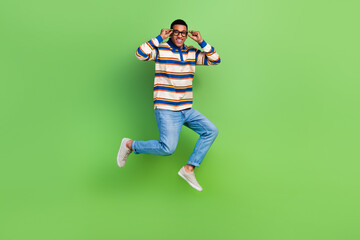 Full body photo cadre of jumping high trampoline air touching new spectacles guy perfect eyesight store isolated on green color background