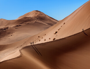 Dune walking in the Namib Desert -Sossusvlei - Namibia