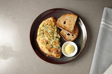 Egg omelette and toast on plate
