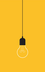 Hanging light bulb on yellow background