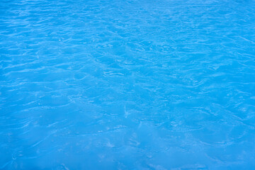 Blue lagoon water color surface rippled