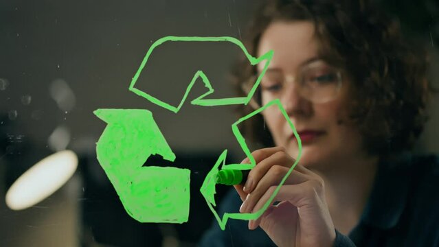 Recyclable Items, Happy Young Woman Doing Charity Active Student Working at Workplace for Charity General Angle Preparing to Recycle Material Recycling, Climate Change. Recycling symbol