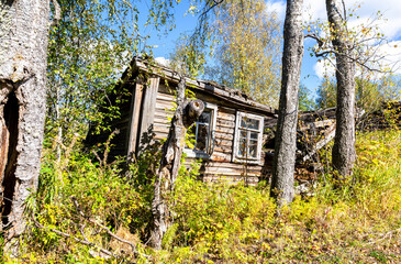 Fototapeta na wymiar Rural abandoned broken wooden house in russian village