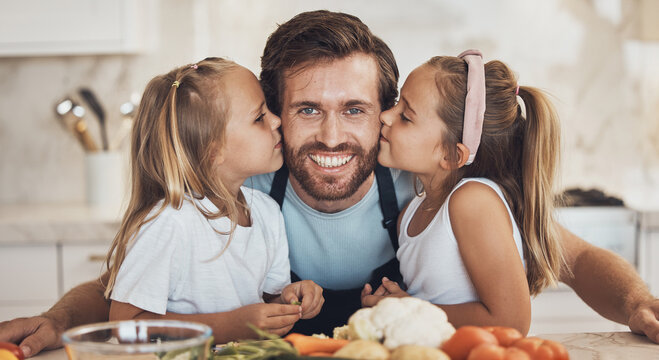 Portrait, family and kiss on the cheek from children with their father in the kitchen of a home for cooking together. Face, smile and girl kids with their happy parent in the house to make a meal