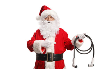 Santa claus holding electric vehicle charger and pointing