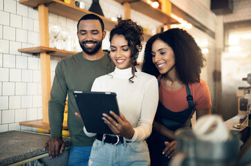 Barista group, coffee shop and together with smile, tablet and planning menu at small business,...
