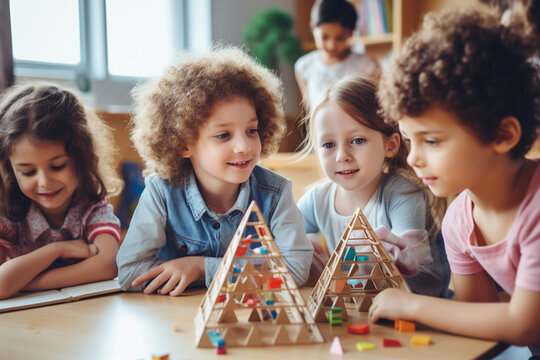 A group of children is learning geometric shapes in a classroom.