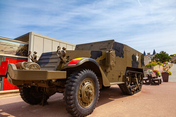Fototapeta premium military armored vehicle from the Second World War era on display in the street on the coast of Arromanches Normandy