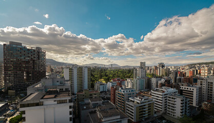 View of the north central area of the city of Quito with La Carolina park in the center during a cloudy sunset