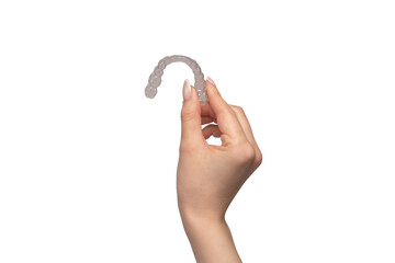 Transparent mouth guard in a woman's hand isolated.