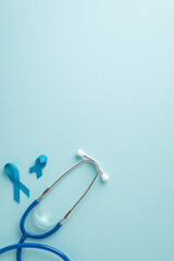 Emphasize importance of men's health month with top view vertical image displaying blue ribbons and...