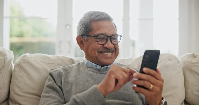 Senior man search phone in home for social media, reading mobile news article and online contact with glasses. Happy retirement, smartphone and download digital app for chat, notification and texting