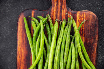 green beans raw fresh bean pod  eating cooking diet meal food snack on the table copy space food background rustic top view keto or paleo diet vegetarian vegan food
