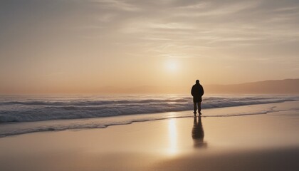 A tranquil beach at sunrise on New Year's Day, with a lone figure contemplating the horizon.