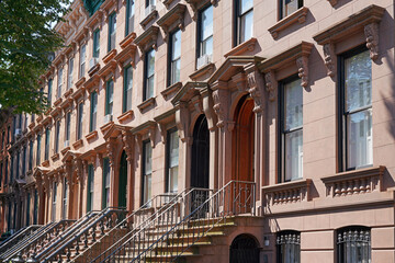 Street of old fashioned brownstone townhouses in New York City