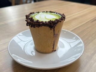 Eatable cup of Green Tea coffee latte