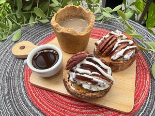 Eatable cup of Coffee and baked potatoes with chocolate mixed milk ice cream