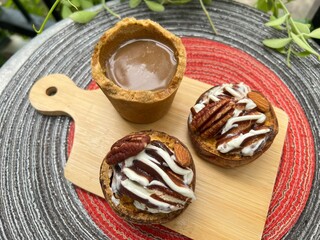 Eatable cup of Coffee and baked potatoes with chocolate mixed milk ice cream