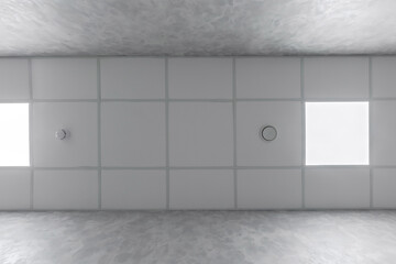 cassette stretched or suspended ceiling with square halogen spots lamps and drywall construction in...
