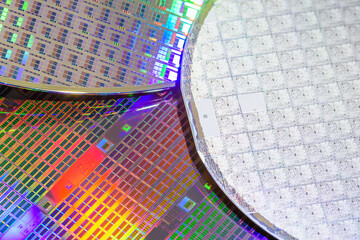 A pattern of microprocessor circuits on a silicon wafer. The semiconductors or central processing unit CPU microchips are fabricated from a silicon wafer with patterned layers of various materials. - obrazy, fototapety, plakaty