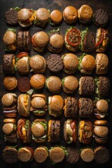 Top view of a lot of fresh delicious beef burgers and steaks on a black background. Fast food, Restaurant concepts