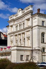 The facade of a historic theater building in Poznan