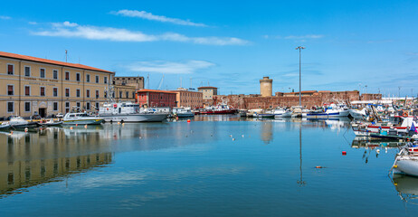 Scenic sight from the harbour of the city of Livorno on a summer morning. Tuscany, Italy....