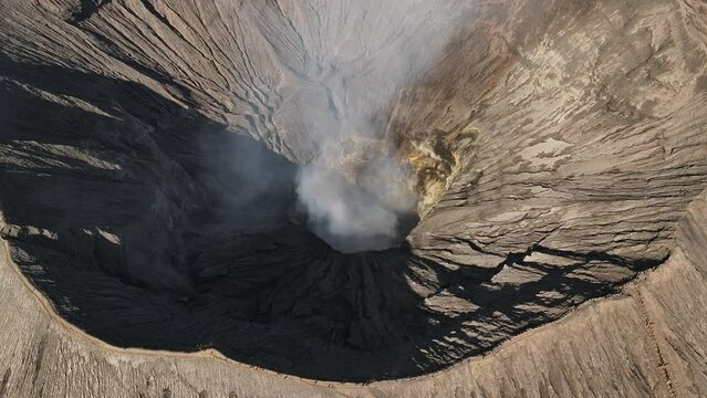 Aerial drone fly orbit around  Bromo volcano crater, Indonesia