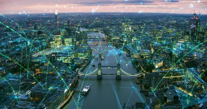 Aerial view of Famous Bridges and Skyscrapers of London Connected though Arch and Line Networks. Concepts: Augmented Reality, Internet of Things, 5G, Modern Wifi. Shot from Helicopter in 8K.
