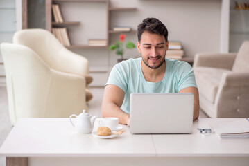 Young male freelancer working from home