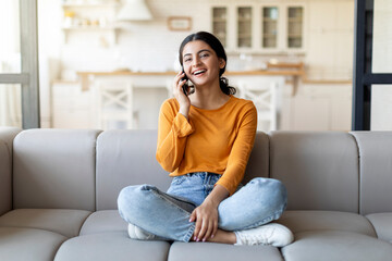 Mobile Call. Happy Young Indian Woman Talking On Cellphone At Home