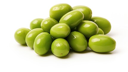 A pile of green olives on a white surface