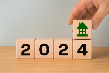 2024, housing market analysis, construction cost, apartment prices, apartment rent, mortgage rate, Business and financial concept, typography, Wooden blocks with date and house icon, close up