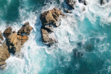 Fotobehang Topdown Aerial View Of Ocean Waves Crashing Against Rocks © Anastasiia
