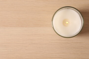 candle on wooden table