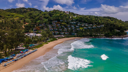 Beautiful beach with colorful water. Top view of the beautiful coastline. Sunny summer day. Colorful water. Sandy beach.	