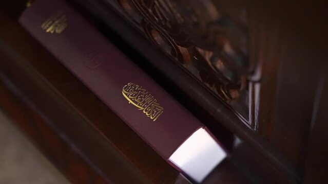 Close up of The Holy Bible spine in Arabic translations in the bench of The Coptic Orthodox Church