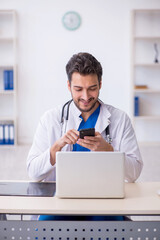 Young male doctor in telemedicine concept