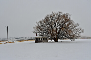 Cold winter scene.  One room schoolhouse on prairie