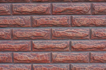 Fototapeta premium horizontal brown decorative smooth modern brick-shaped fence texture with concrete on the street
