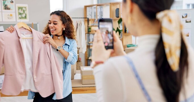 Fashion influencer, cellphone and women live streaming clothes presentation, style review or mobile app broadcast. Phone, content creator team and small business owner teamwork on retail commercial - Powered by Adobe