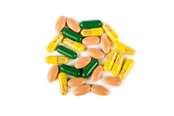 Medications in capsules and tablets isolated on white background.