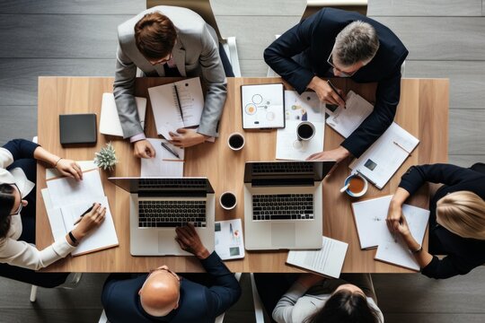 Top View Of Office Workers Working At Table Together