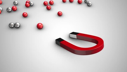 Magnet attracting chrome balls business leadership concept