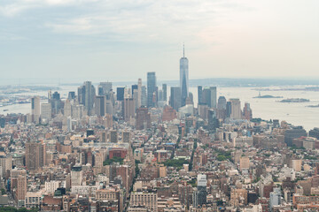 Fototapeta na wymiar Aerial panoramic city view of Lower Manhattan , Midtown, Downtown, Financial district and West Side at day time, NYC, USA. New Jersey on horizon over the Hudson River. A vibrant business neighborhoods